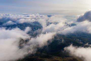 Fototapeta na wymiar Aerial view of city pass through cloud from Mt. Dai Mo Shan 