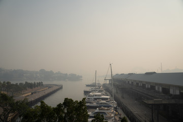 Sydney, NSW - November 21th 2019: The Sydney skyline behind Pyrmont is engulfed in smoke from...