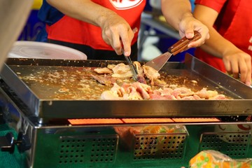 Fototapeta premium chef cutting meat