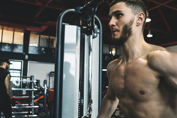 handsome bearded guy training in a gym