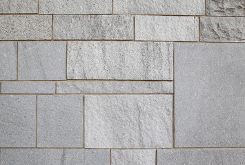 Fototapeta premium Gray stone wall closeup background photo texture