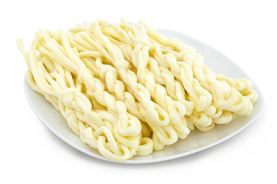 Cheese korbash, salty delicacy. Produced in the Slovak Republic under the name "korb&aacute;čik" or "korb&aacute;čiky". Traditional entangled cheese treat from Central Europe. Isolated on white with clipping path.