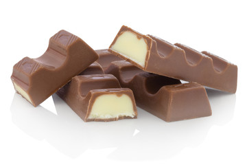Chocolate bars with milk filling. Isolated on white background with shadow reflection. With clipping path. With vector path. Milk dessert on white bg. Chocolates on white reflective underlay.