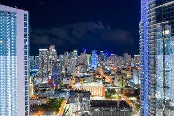View of Downtown Miami between tall towers lit at night