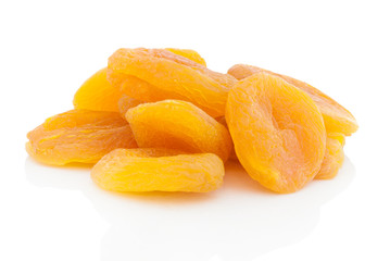Dried stoneless apricots. Isolated on white background with shadow reflection. With clipping path. With vector path. Dried heap of apricots on white bg. Dried fruits on white glossy underlay.