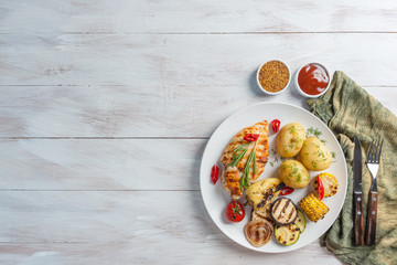 Chicken fried fillet and grilled vegetables
