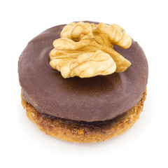 Creamy cocoa cake with biscuits and walnut on top. Christmas pastry in Slovakia. Isolated on white background with shadow reflection. With clipping path. With vector path.