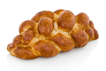 Fancy bread with raisins in slovak called: Vianocka. Sweet leavened bread slices with and one whole piece in the back. Easter bread. Isolated on white bg. with shadow reflection. With clipping path.