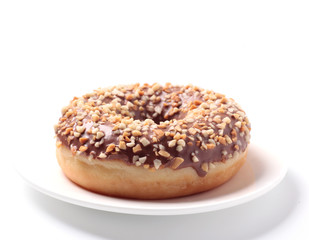 a single doughnut on a white plate