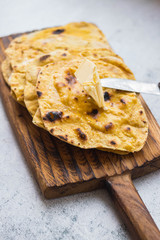Chapati Indian flatbread. Traditional round bread. Vegan, vegetarian healthy food. Butter naan