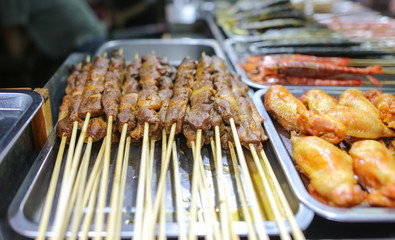 Animal meat on wooden sticks for grilling