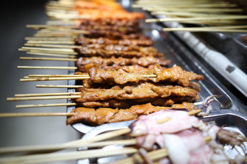Animal meat on wooden sticks for grilling