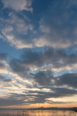 sunrise over the lake. cloudy sky.