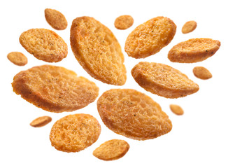 Bread croutons levitate on a white background