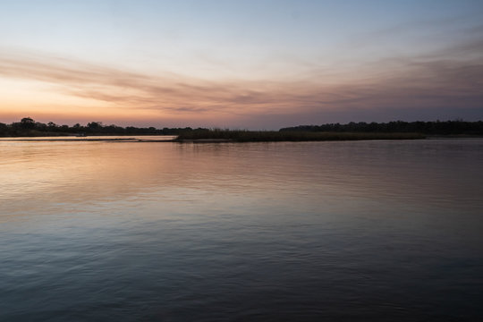 Serene, Tranquil Okavango River Landscape at Dusk