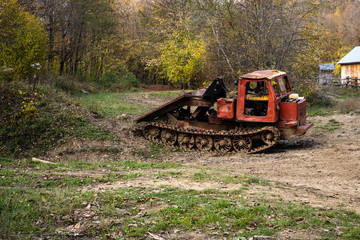 old skidder in the autumn forest