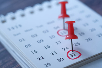 deadline concept with push pin on calendar date 