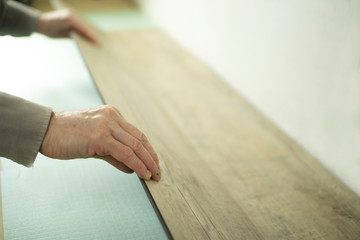Vinyl laminate. Laying of the floor covering.