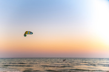 kitesurfing on the blue sea on a bright Sunny day