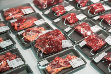 Raw beef meat in plastic box in supermarket