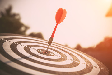 The bullseye, or bull's-eye or dart board has dart arrow hitting the center of a shooting target...