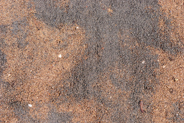 Gray and brown fine gravel stones for the underground for paving stones