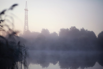 Fog in the lake. Morning nature water white fog.