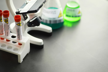 A blood sample for testing the dangerous virus coronavirus in the body. Test tubes with tests for coronavirus. Laboratory studies of viral diseases.