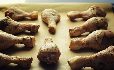 Baked chicken in the oven. Turkey legs on a baking sheet with spices baked in the oven. Snack on Thanksgiving Day.