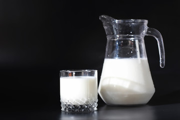 Milk drink in a glass. Farm milk and cookies. Delicious snack with cow's milk and fresh pastries.
