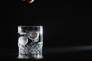 Water soluble tablets. The medicine is soluble. Anti-hangover. Effervescent tablets in a glass.