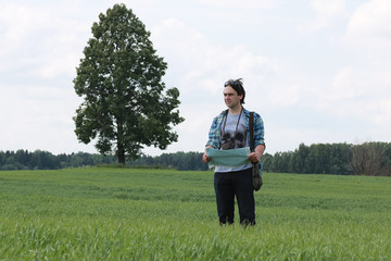 A young man looks at a map