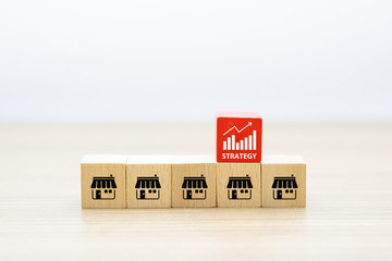 Franchise business. a cube shape wooden toy blog stacked with franchise marketing icons store of...