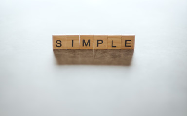 Wooden blocks with word SIMPLE for  simplicity and minimalism concept