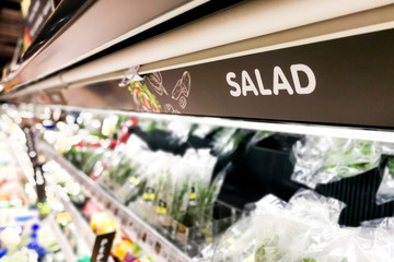 Salad signage at supermarket with defocused background