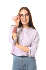 Young woman with stylish eyeglasses on white background