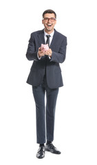Happy male bank manager with piggy bank on white background