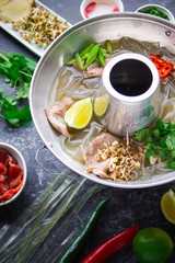 Vietnamese pho bo soup, Asian cuisine, Photo on a dark background