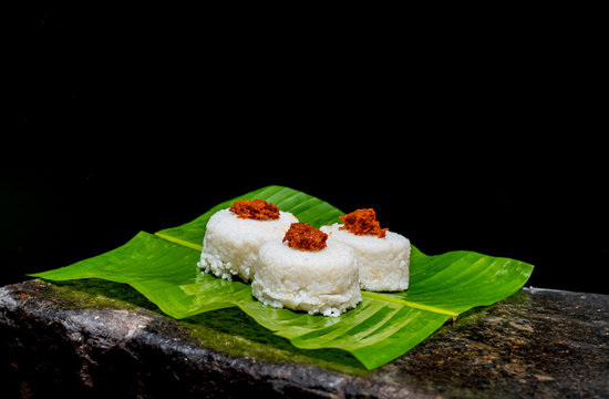 The milk rice on a banana leaf. Milk rice is a traditional Sri Lankan food made from rice and coconut milk which is used to be a main food on any cultural ceremony or occasion