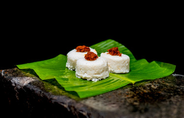 The milk rice on a banana leaf. Milk rice is a traditional Sri Lankan food made from rice and coconut milk which is used to be a main food on any cultural ceremony or occasion