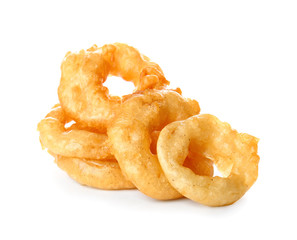 Crispy fried onion rings on white background