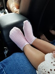 Closeup of pink socks worn by young girl.  Health care concept.