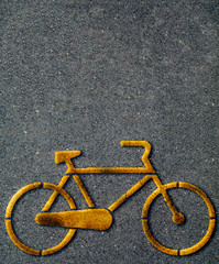 Paved cycle lane with yellow bicycle symbol