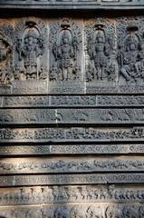 Carved idols on the outer wall of Hoysaleswara temple, is a 12th-century Hindu temple dedicated to lord Shiva, Halebeedu, Karnataka, India