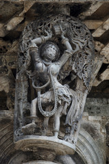 Carved sculptures on the outer wall of the Chennakeshava Temple complex, 12th-century Hindu temple dedicated to lord Vishnu, Belur, Karnataka, India