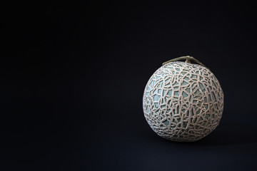 The Yubari King or Yubari melon on black background.