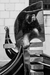 Black and white close up of the iron comb of a venetian gondola © Roberto