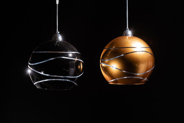 Modern lamp, chandelier on a black background. Lighting element of the interior. environmental materials of lamps