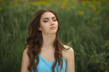 Naklejka premium Woman on the Green Spring Meadow on Nature
