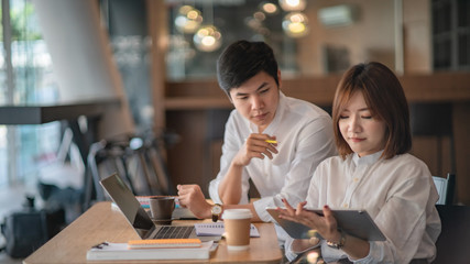 Young business teamwork working with business report document on office desk.Brainstorming Business People Design Planning,Brainstorming Planning Partnership.	